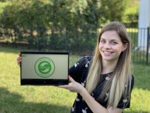 Woman holding computer showing Certified Lexile Partner logo
