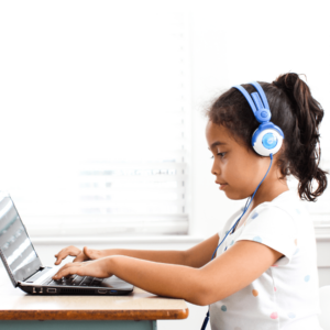 Student completes reading lesson on computer for distance learning.