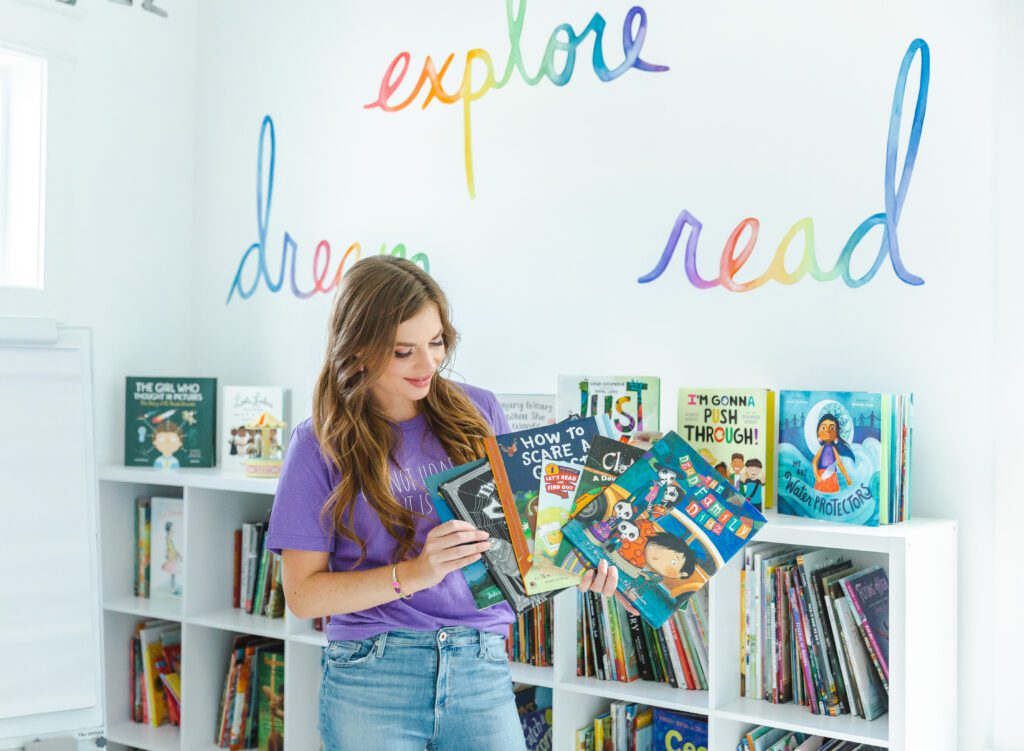 Julie Bochese showing her favorite picture books for halloween