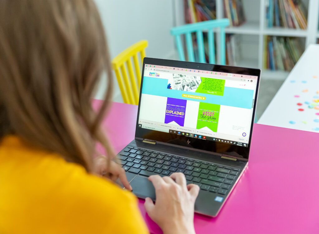 Woman on computer reviewing thanksgiving day teaching resources