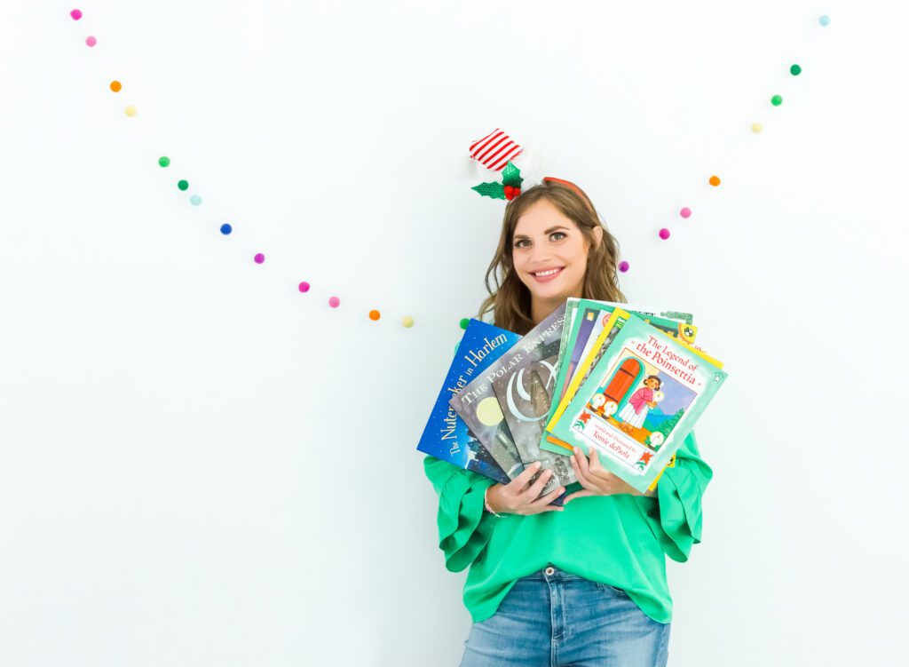 teacher with various books focused on teaching about holiday around the world with read alouds