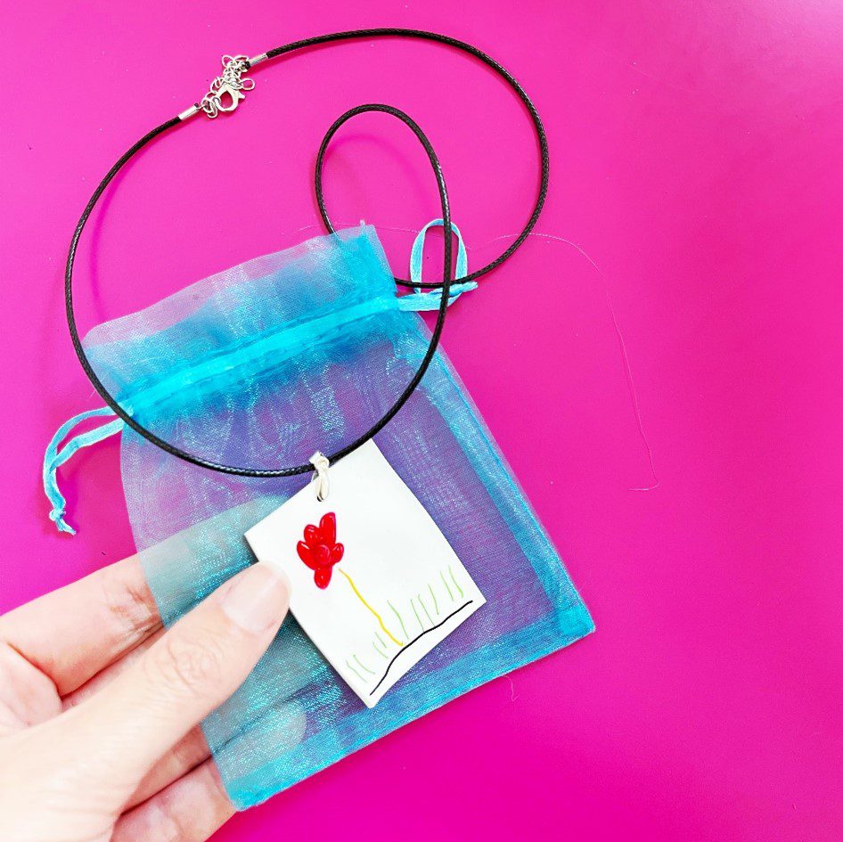 woman's hand showing a shrinky dink Mother’s Day Gift Ideas for Elementary School