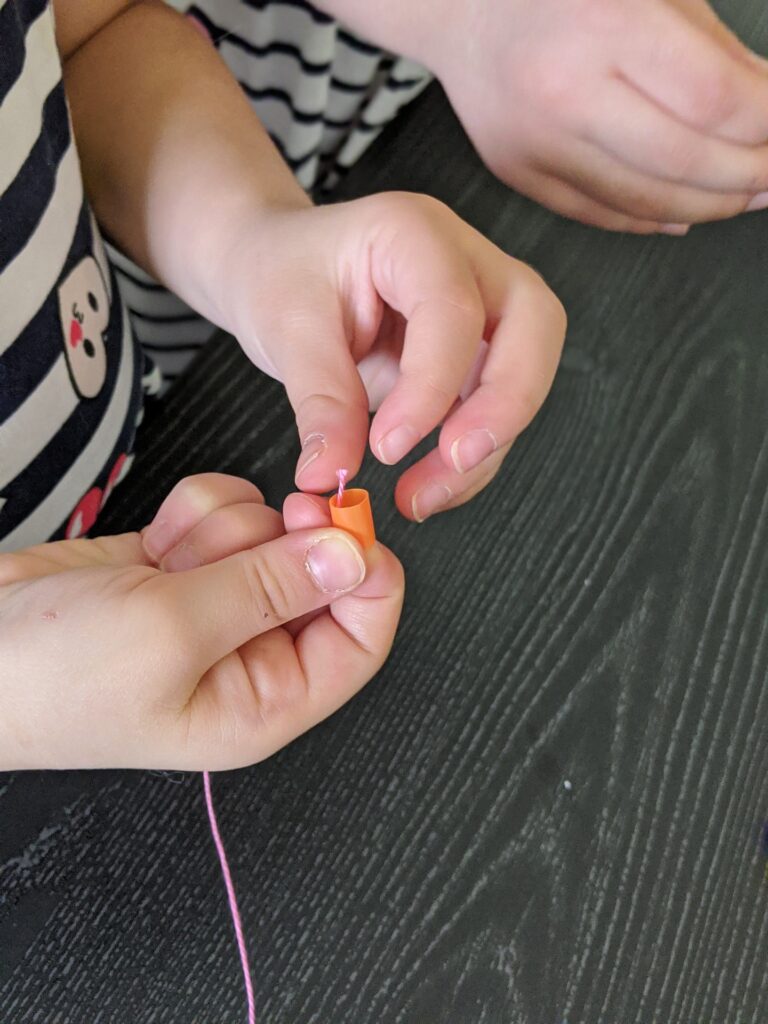 To celebrate the 100th day of school, students can make necklaces by counting out ten of each color bead (of your choice) and string them together.