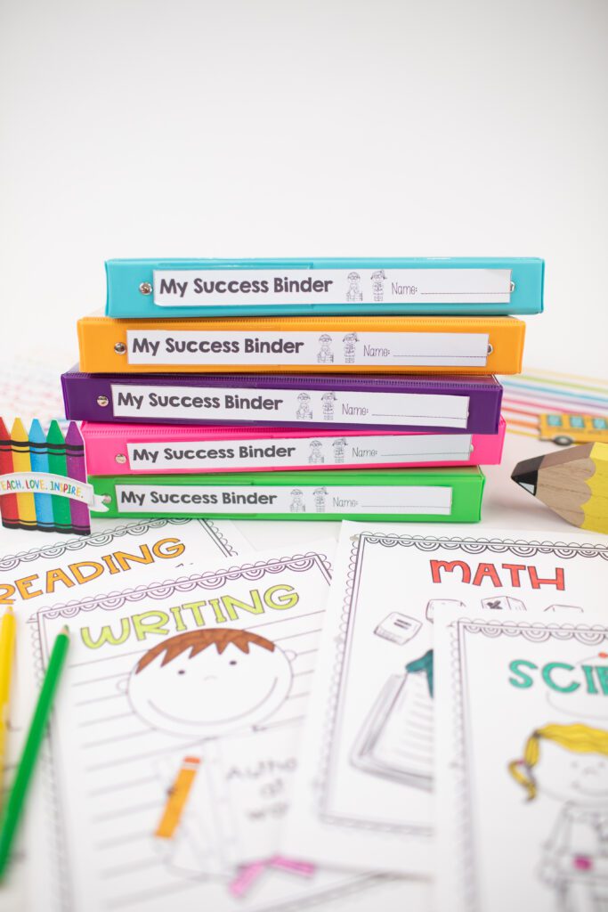 Teacher and student data binders stacked in colored folders